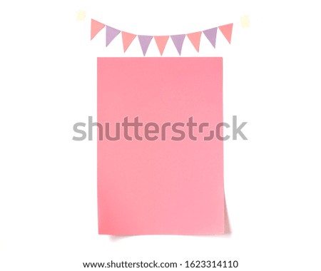 Festive background with bunting flags garland and pink blank paper on white backdrop. Birthday, wedding, baby shower, party, holiday concept. Flat lay, top view, copy space, mock up.