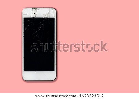 Broken screen on pink background, Smart phone with crashed monitor. telephone problems. Device destroy problem. gadget needs repair
