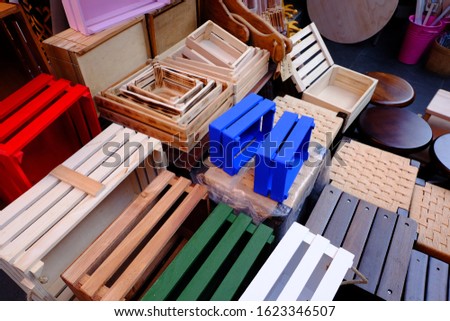 Selling empty colorful wooden crate boxes for sale in a market, Eminonu, Fatih, Istanbul. It can be used home decoration such as making furniture, putting fruits or vegetables.