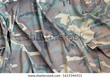 Camouflage background texture as backdrop for hunting or fishing design projects
