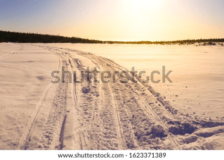 Sunrise over a winter trail