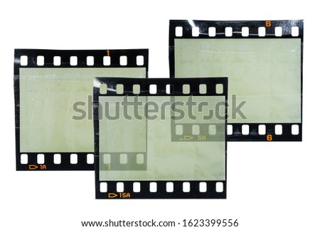 three blank 35mm film snips or strips isolated on white background overlapping each other, cool poster idea, digital collage, empty photo placeholder for your content.