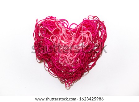 Pink heart from threads on a white background Valentine's Day banner