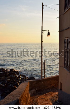 a suggestive view of Genoa at sunset