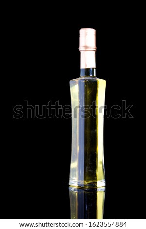 Luxury design of wine bottle. Isolated picture of glass bottle with black background. Glass bottle mock up design.