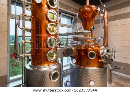 Custom Made modern Copper still machine to still and  produce spirits. Royalty-Free Stock Photo #1623599344