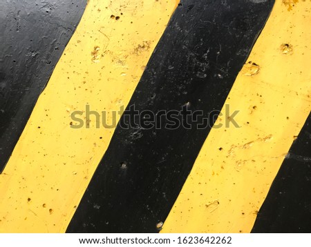 The surface shape of the yellow-black barrier. Texture and background.