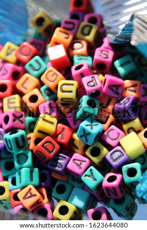 Colorful alphabet blocks and beads. 