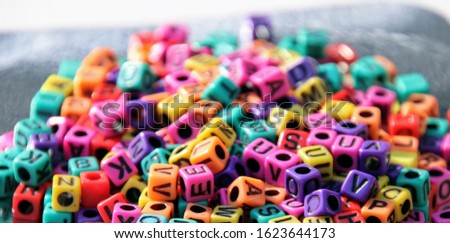 Colorful alphabet blocks and beads. 