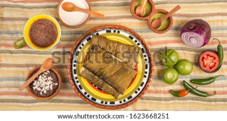Tamal de Oaxaca, Mexican dish made with corn dough, chicken or pork and chili, wrapped in a banana leaves.