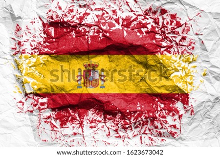 The national flag of the Spain is painted on crumpled paper. Flag printed on the sheet. Flag image for design on flyers, advertising.
