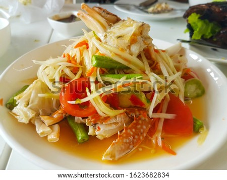 Spicy crab papaya salad, Thai food Royalty-Free Stock Photo #1623682834