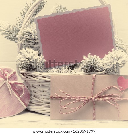 Valentine’s day concept with blank card, envelope and gift box. Warm color toned image. Old photo stylized