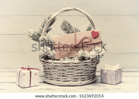 Valentine’s day concept with envelope and gift boxes. Warm color toned image. Old photo stylized