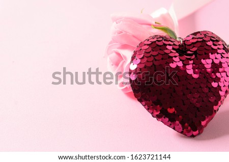 Heart on a pink background. Composition for Valentine's Day Royalty-Free Stock Photo #1623721144