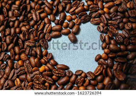 heart made from coffee beans for the whole frame, a beautiful postcard for a loved one, advertisement or coffee shop menu