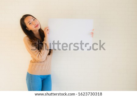 Portrait beautiful young asian women show blank white board card with copy space