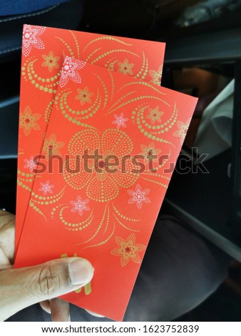 Red packet also known as angpow. It is a gift with money in it during chinese new year celebration. 