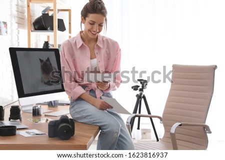 Professional photographer working in light modern office