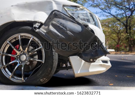 Front of white color car big damaged and broken by accident on road parking can not drive any more. With copy space for text or design
