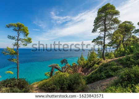 Amazing beautiful sea landscape of Greece. View from above at blue transparent sea water and clear sky. Horizontal color photography.