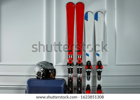 Winter background of ski with white wall and free space for your decoration 