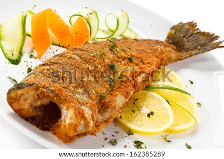 Fish dish - fried fish and vegetables 