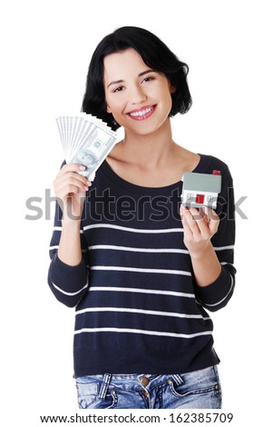 Attractive girl with money and house on hands.  isolated on white. 