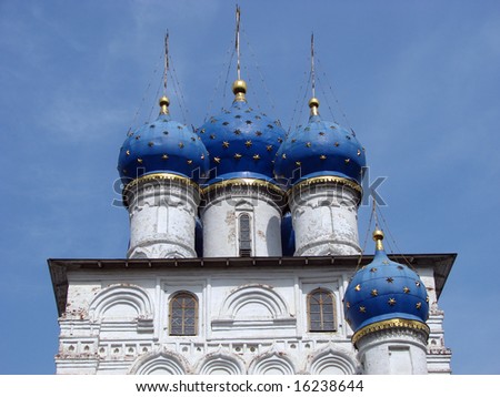    Christian temple with domes on a background of clouds