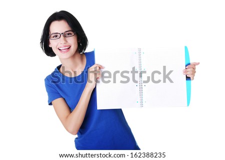 Attractive woman holding workbook in front, copy space. Isolated on white. 