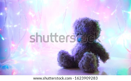 Teddy Bear soft toy Bear on the background of multi-colored lanterns, a gift for Valentine's Day, me to you