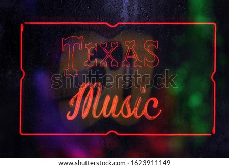 Neon Texas Music Sign in Rainy Window