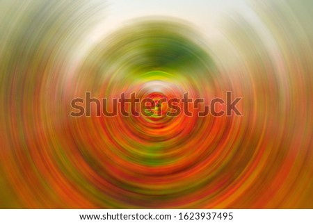 Abstract pixel background of spin circle radial motion blur.