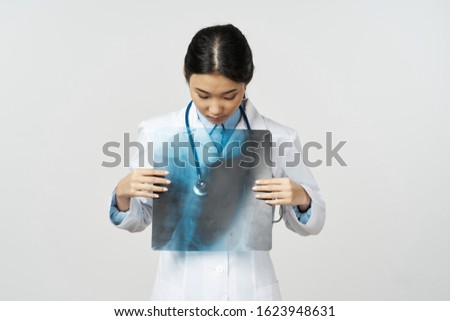 Female doctor white coat medicine diagnosis x-ray