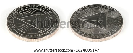 Face and back side of the crypto currency silver tron isolated on white background. High resolution photo. Full depth of field.