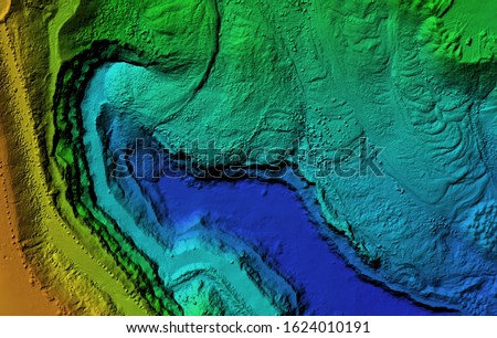 Digital elevation model. GIS product made after proccesing aerial pictures taken from a drone. It shows map of an excavation site with steep rock walls Royalty-Free Stock Photo #1624010191