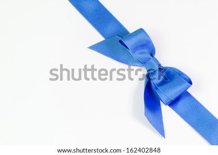 Royal blue ribbon and bow isolated on white
