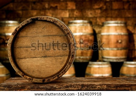 Brown old retro barrels with free space for your decoration.Dark interior and shadows.Copy space and top of empty table. 