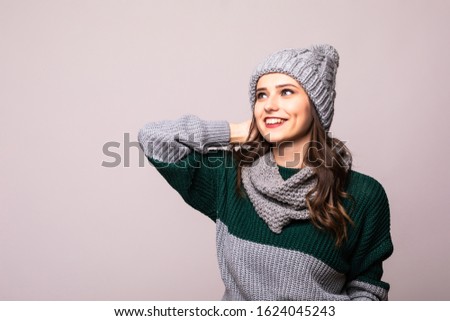 Young woman with winter hat over isolated white background