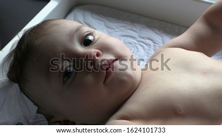 Baby wanting to touch camera, Infant toddler reaching out to lens