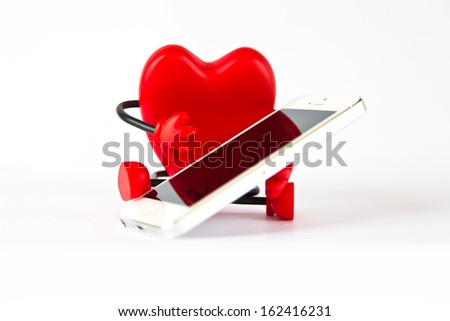 Red heart shaped bra holding cell phone