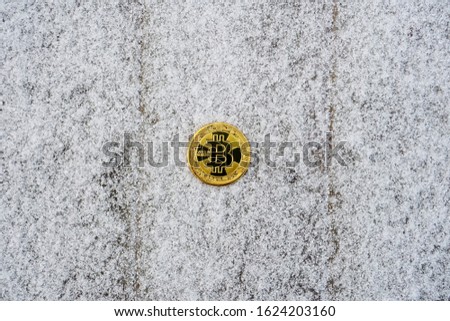 Bicoin coin on snow background.Digital currency. Cryptocurrency                   