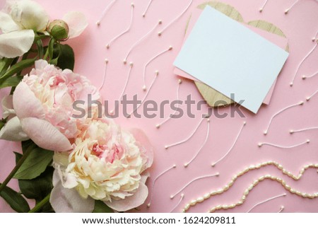 Happy valentines day greeting card design. a bouquet of pink peonies, a wooden heart and place for text