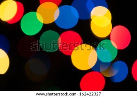 Colorful natural bokeh texture on dark background