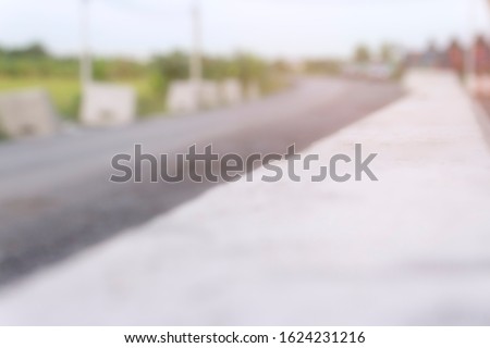 background concept: blurred picture of the concrete road at a construction site