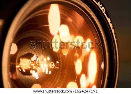 A closeup shot of the golden lights in the camera lens