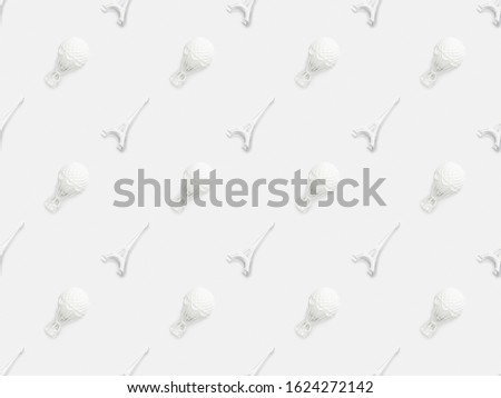 top view of eiffel tower statuettes and air balloons figurines isolated on white