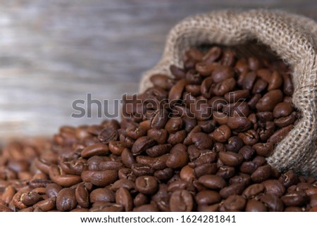 Coffee beans spill out of the bag.