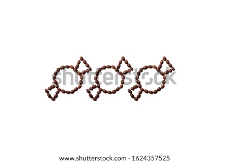 Candy shape made with roasted coffee beans placed on white background from the top view can use for your messages