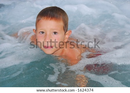 Relaxed boy in a jacuzzi
